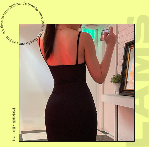 A woman in a black dress showing a slim waist and enhanced curves after Herpagori LAMS.